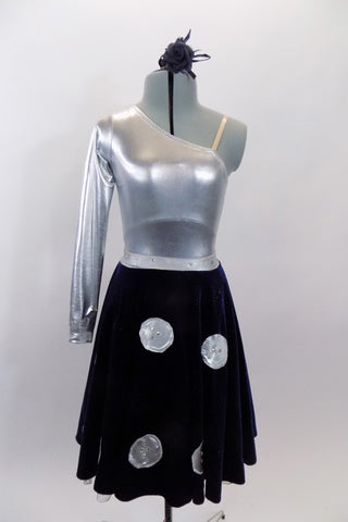Silver metallic one shoulder long sleeve leotard is accompanied by navy blue velvet skirt with large crystalled silver buttons. Skirt has ruffled petticoat. Comes with hair accessory. Front