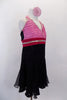 Halter A-line dress has light pink pleated cross-over front bodice & hot pink waistband both lined with crystals. Skirt is layers of black crystal sheer. Comes with matching hair accessory. Side