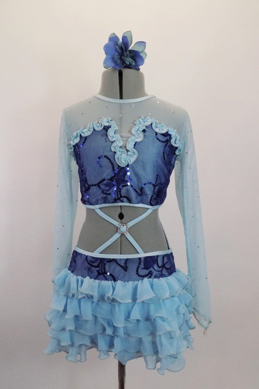 Pale blue long sleeved mesh half-top scattered with crystals, has ruffled bust area with dark blue sequin lace overlay. It is attached to ruffled chiffon skirt. Comes with blue floral hair accessory. Front