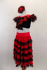 Spanish style 2-piece costume has calf length red & black lace ruffled skirt. Black velvet half top has bow & red sequin applique front & short ruffled sleeves. Comes with matching hair accessory. Side