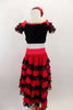 Spanish style 2-piece costume has calf length red & black lace ruffled skirt. Black velvet half top has bow & red sequin applique front & short ruffled sleeves. Comes with matching hair accessory. Back