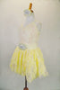 Pale yellow-cream dress has cream sequined pinch-front camisole bodice with rose-ribbon lace skirt over tulle petticoat. Has starburst waist and hair accents. Side