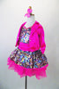 Sparkly camisole dress in rainbow sequins sit on a hot pink tutu skirt, with pink straps & cummerbund waist. Comes with matching pink jacket & hair accessory. Left side view jacket open