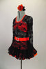 Black lace dress has glittery orange underlay at skirt and bust area & bright orange neckline & belt with crystal buckle for bling. Comes with hair accessory. Side