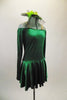 Simply Irish, green velvet off-shoulder dress ling sleeved dress has nude shoulder straps for support. Comes with green veiled hat accessory. Right side
