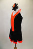 Black & bright orange halter dress has crystal covered orange front center & skirt ruffle. The back is open & ties at both center & neck. Comes with hair accessory. Left side