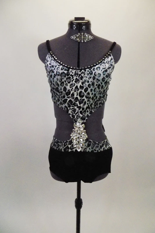 Black & grey animal print has open side with black brief bottom & bra back closure with adjustable straps. Front center has a large crystal embellishment. Comes with hair barrette. Front