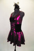 Fuchsia metallic camisole dress has full skirt with brief. Front is embellished with black velvet bow. Has black velvet corset belt & mini top-hat accessory. Left side