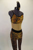 Tiger print unitard has nude mesh center to create illusion of a 2-piece. The back has bra closure and adjustable straps.. Comes with hair accessory. Right side
