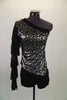 Black & silver asymmetrical top has silver & black pattern & a single sleeve of layered black fringe. Comes with black high waisted shorts & hair accessory. Front