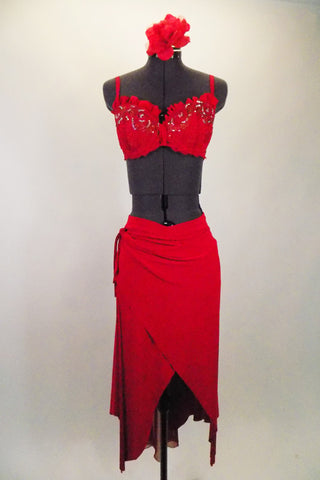 Red 2-piece costume has a unique wraps style sarong skit that  flows beautifully. The matching hand-painted bra has ruffle & is adorned with crystals. Comes with floral hair accessory. Front