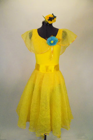 Sunshine yellow dress has full circle lace skit. The body is a Lycra tank base with lace Puritan collar & blue flower. Comes with sash & flower hair accessory. Front