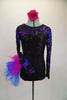 Black sequined leotard with sweetheart neckline has sheer black mesh upper with long sleeves covered in blue & magenta sequined swirls & large right hip pouf. Comes with matching floral hair accessory. Front