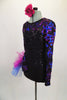 Black sequined leotard with sweetheart neckline has sheer black mesh upper with long sleeves covered in blue & magenta sequined swirls & large right hip pouf. Comes with matching floral hair accessory. Left side