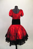 2-piece costume is a shimmery red with pouf sleeves & gathered bodice, accompanied by a matching skirt with layers of black tulle and black velvet corset belt. Comes with matching kerchief. Back