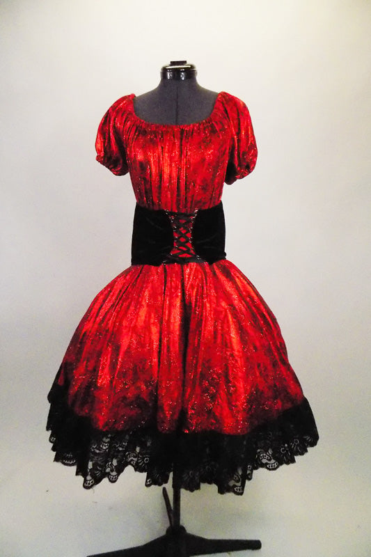  2-piece costume is a shimmery red with pouf sleeves & gathered bodice, accompanied by a matching skirt with layers of black tulle and black velvet corset belt. Comes with matching kerchief. Front