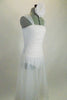 Soft, sheer white gossamer dress has sheer flowing skirt & ruching in front center of bodice, Has wide gossamer shoulder straps and floral hair accessory. Right side