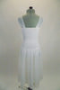 Soft, sheer white gossamer dress has sheer flowing skirt & ruching in front center of bodice, Has wide gossamer shoulder straps and floral hair accessory. Back
