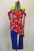 Funky 70’s themed costume has capri-length electric blue metallic pants accompanied by a brightly colored, angle cut flower pattern top with matching gauntlets & hair accessory. Front