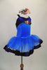 Blue tutu has deep blue velvet bodice with gold trim & cross straps. The tulle skirt has blue velvet trim accent. Front has rose detail & matching hair piece. Right side