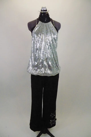 3-piece costume comes with semi-stretch black, dress pants with crystal star pattern on leg. Silver, open-back tunic sits over top of black crystalled bra. Comes with silver mini hat and long crystalled gloves. Front