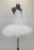 Professional pancake tutu has all white pleated tutu with silver sequin edging. White stretch bodice has silver  print with deep plunge bodice & crystal straps. Comes with hair accessory. Right side