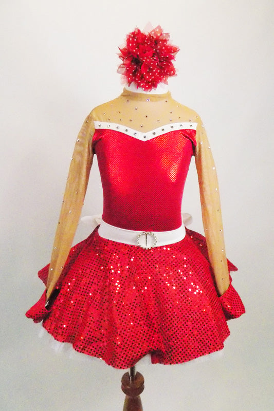 Red 2-piece crystal covered costume has sweetheart neck, nude sheer, upper, sleeves & keyhole back The skirt is a red sequined with crystal buckle & back bow. Comes with hair accessory. Front