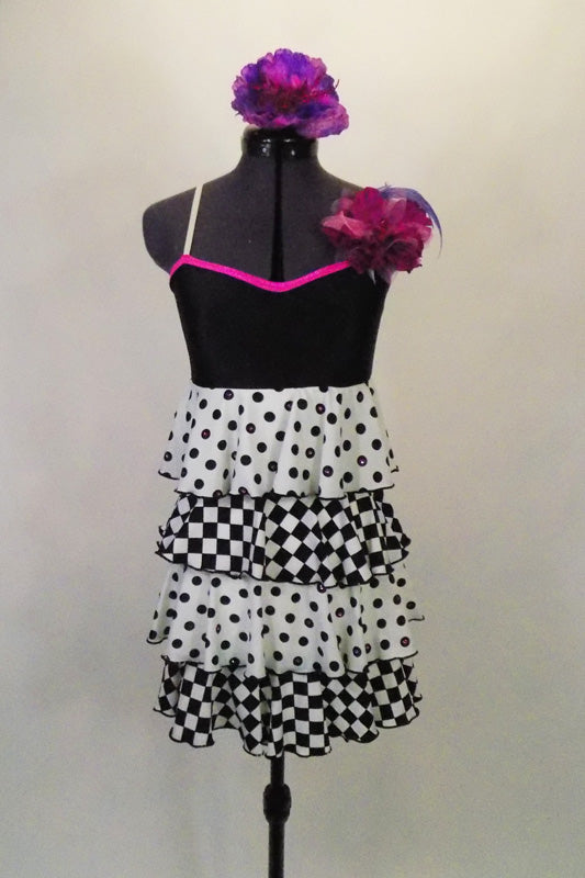 Camisole dress with black bust & flower is an optical illusion with layers of black & white ruffles alternating between checkers & polka-dots. Has hair flower. Front
