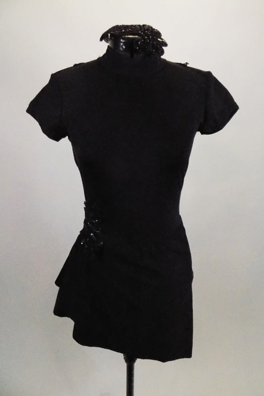 Black unitard has sarong skirt & large keyhole open back. Front is closed with high neck & cap sleeves. Comes with black appliques at back, shoulder & hips and applique hair accessory. Front