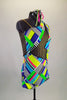 Unique, colorful striped block print asymmetrical leotard has single left sleeve. A black, mesh insert crosses the torso at an angled and the whole back. Comes with hair accessory.  Right side