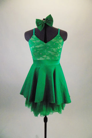 Pretty emerald green dress has crystaled lace bus & wide waistband. The high-low skirt has a green layered petticoat for volume & softness. Comes with hair bow. Front