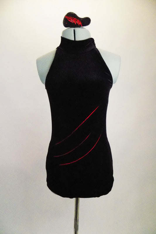 Black velvet leotard is full coverage front with high halter neck. Back is black sheer mesh with asymmetrical cut. Torso has red slash marks below the velvet. Comes with hair accessory. Front