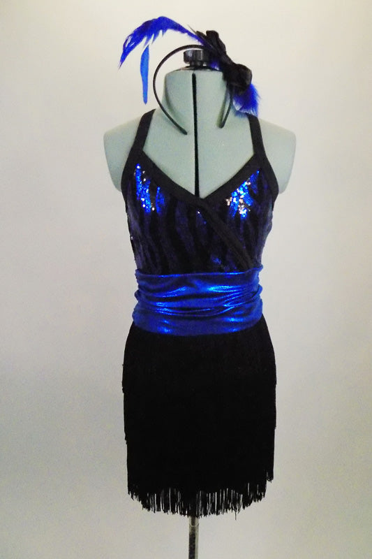 Black & blue patterned cross-front sequined top is attached to a black layered fringe skirt. The skirt and top are accented by a blue metallic cummerbund belt. Comes with matching hair accessory. Front