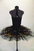 Black platter pull-on tutu with black & gold scalloped lace overlay compliments the matching leotard with gold lace front insert. Comes with gold hair barrette. Back