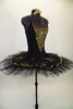 Black platter pull-on tutu with black & gold scalloped lace overlay compliments the matching leotard with gold lace front insert. Comes with gold hair barrette. Side