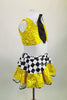 Yellow sequined skirt with black & white peplum & petticoat accompanies a matching open backed half-top. Comes with faux shirt collar, tie, gloves & taxi hat.  Side