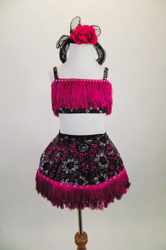 2-piece costume has black velvet base with silver & fuchsia flowers, wide fuchsia tassel & crystals along edging.The back of top has lace up tie closure. Comes with matching hair accessory. Front