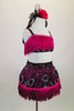 2-piece costume has black velvet base with silver & fuchsia flowers, wide fuchsia tassel & crystals along edging.The back of top has lace up tie closure. Comes with matching hair accessory. Side