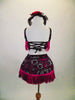 2-piece costume has black velvet base with silver & fuchsia flowers, wide fuchsia tassel & crystals along edging.The back of top has lace up tie closure. Comes with matching hair accessory. Back