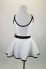 Shiny white lycra dress has low scoop back & black banding covered with crystals. Front torso is sheer ruched white & black polka dots. Has dotted daisy accents. Back