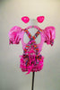 Pink piggy-themed 2-piece costume has pouf sleeved half top with keyhole back & laced back. Matching short has back ruffles, curly tail & attached suspenders.  Comes with clip-on ears. Back