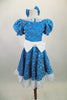 Blue brocade motif glitter velvet 2-piece costume has pouf sleeved leotard with lace collar. The matching knee-length skirt has lace trim & waistband with bow. Comes with matching hair bow. Back
