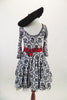 French flare, black and white damask motif, scoop neck dress has tulle crinoline and bright red tie belt. Comes with black felt beret hat. Back