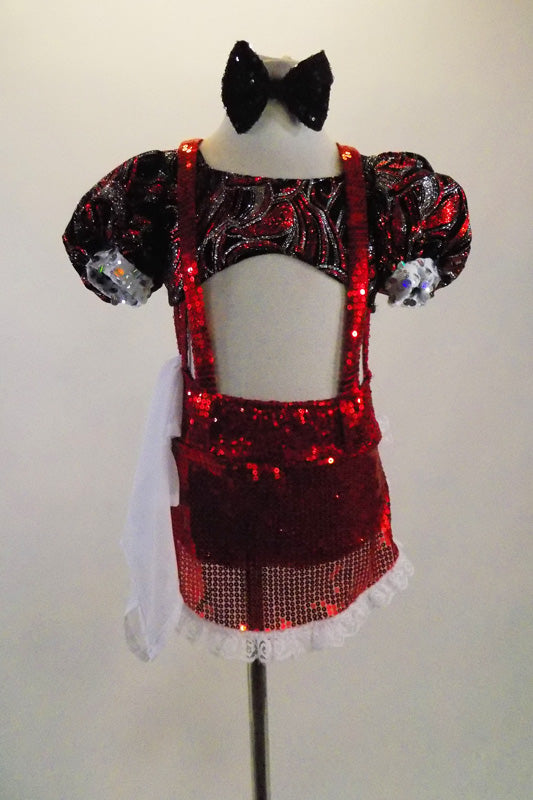 Silver red & black swirl, pouf sleeved half top is attached to red sequined shorts with side straps, red suspenders & sequined apron. Comes with dust cloth. Front
