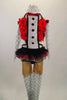 Red metallic halter half top has red 3-D flowers,bow tie, ruffled tuxedo lapel that attaches to the skirt of black & red ruffles. Comes with tights & gauntlets. Front