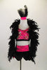 Pink & black three-piece costume has pink lace bra-top & black shorts with pink lace front. The  shrug has pink lace on sleeves and is adorned with feathers. Comes with feather hair accessory. Front