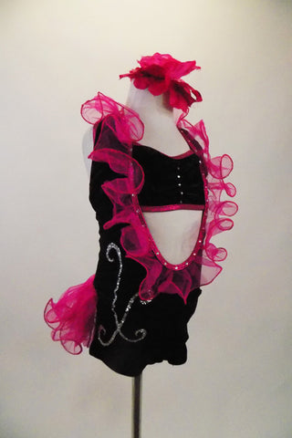 Black velvet short unitard has halter neck, deep open front & back, with hot pink organza curly ruffle trim and bustle. Comes with matching bandeau bra & flower Right side