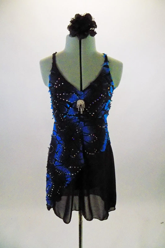 Black & blue angle dress has crackle pattern with crystal accents throughout over black chiffon. Costume has large Swarovski crystal brooch accent at bust and floral hair accessory. Front