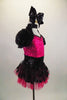 Dress with mini sequined hot pink bust has Queen Anne neckline with  black sequined upper, pouf sleeves & open back. Matching skirt has polka dot overlay. Comes with large black sequined hair bow. Right side