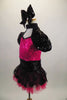 Dress with mini sequined hot pink bust has Queen Anne neckline with  black sequined upper, pouf sleeves & open back. Matching skirt has polka dot overlay. Comes with large black sequined hair bow. Left side